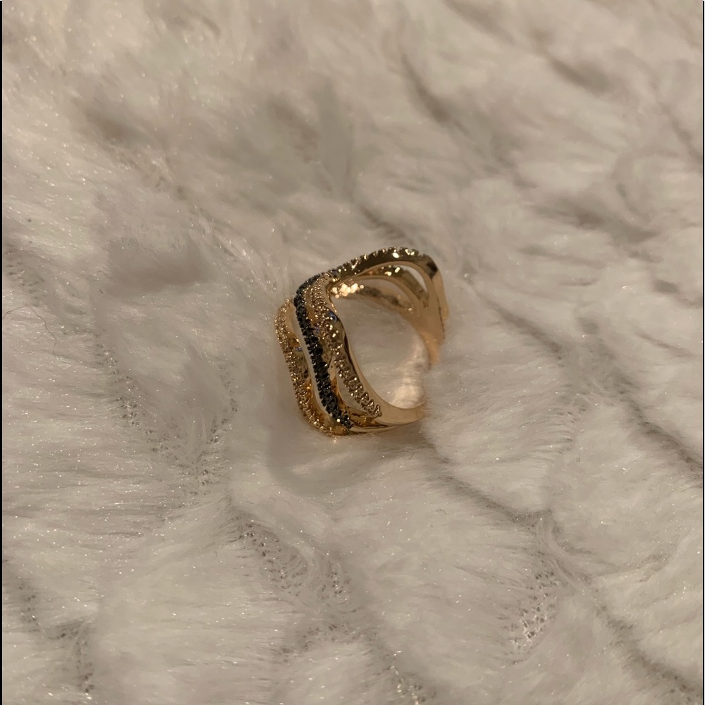 Brazilian gold plated ring.  With two colors with and black stones size 8.